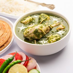 Green Palak chicken Curry or Murgh Hariyali Tikka Masala or spinach Murg Saagwala served with rice and laccha paratha
